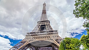 Champ de Mars and the Eiffel Tower timelapse hyperlapse in a sunny summer day. Paris, France