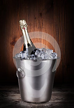 Champagne bottle in a bucket with ice