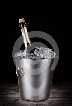 Champagne bottle in a bucket with ice