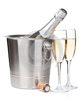 Champagne bottle in bucket and two glasses