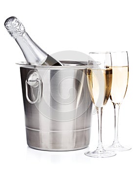 Champagne bottle in bucket and two glasses