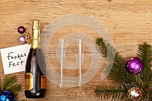 Champagne bottle, card Happy Holidays, champagne glasses and fir