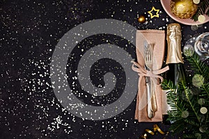 Champagne bottle with christmas decoration on dark background