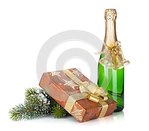 Champagne bottle, christmas gift box, decor and fir tree