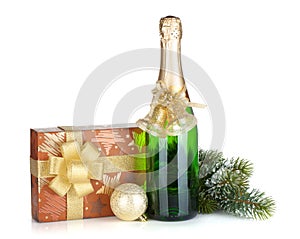 Champagne bottle, christmas gift box, decor and fir tree