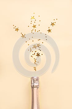 Champagne bottle with confetti stars