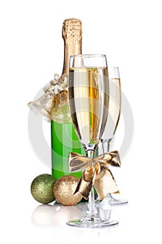 Champagne bottle, glasses and christmas decor