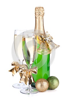 Champagne bottle, glasses and christmas decor