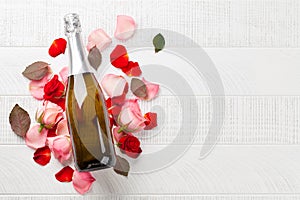 Champagne bottle and rose flowers