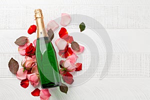 Champagne bottle and rose flowers