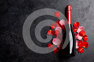 Champagne bottle and rose flowers