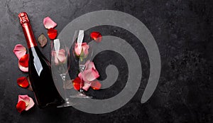 Champagne bottle and rose flowers