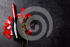 Champagne bottle and rose flowers