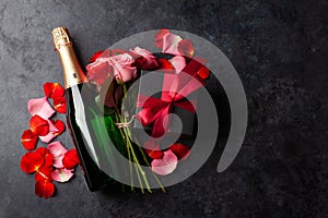 Champagne bottle and rose flowers