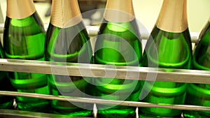 Champagne bottles on factory conveyor belt