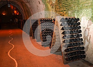 Champagne bottles in pupitre in Reims, France