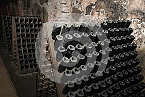 Champagne bottles in pupitre in Reims, France