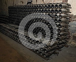 Champagne bottles in stock at champagne cellar in Reims