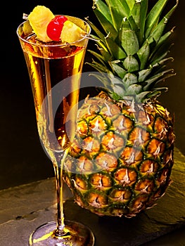 Champagne cocktail with cherry and pineapple