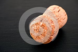 Champagne cork on black background