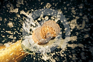 a champagne cork is popping out