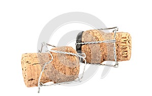 Champagne corks with muselis isolated on white background