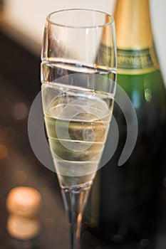 Champagne flute with cork and bottle
