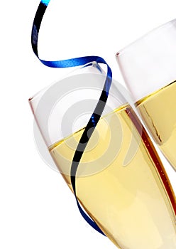 Champagne flutes with blue ribbon closeup