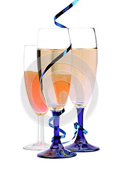 Champagne flutes with blue ribbon closeup