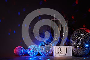 Champagne flutes, disco balls,  fir branch, microphone, New Year. 31 december. Karaoke, club, bar