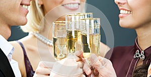 Champagne flutes touching