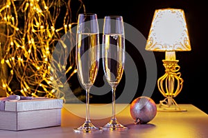 Champagne, Gift Box And New Year Decoration.