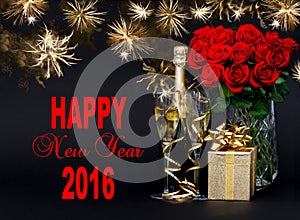 Champagne, gift, flowers and golden fireworks. Happy New Year 2016