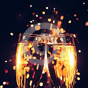 Champagne glass against sparkler background