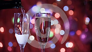 Champagne glass close up on Christmas and New Year holiday bokeh background