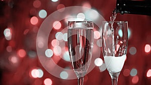 Champagne glass close up on Christmas and New Year holiday bokeh background