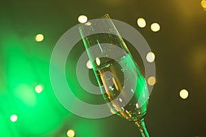 Champagne glass in disco party bar