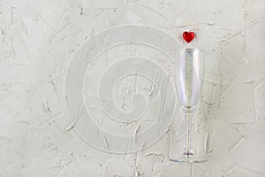 champagne glass with red heart on white background.. Valentine's Day concept