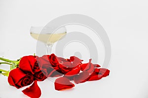 champagne glass with rose leaves abstract background