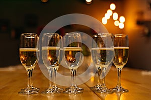 Champagne Glasses on Bar Counter with Warm Ambient Light