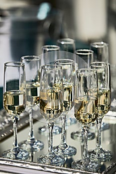 Champagne glasses being served on a party