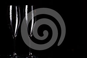 Champagne glasses on black spray photo