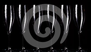 Champagne glasses on black spray