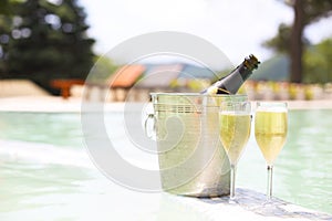 Champagne glasses and bottle in ice bucket