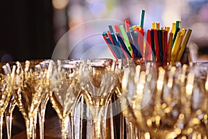 Champagne glasses and cocktail straws
