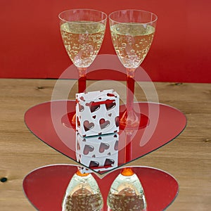 Champagne glasses and gift box in heart