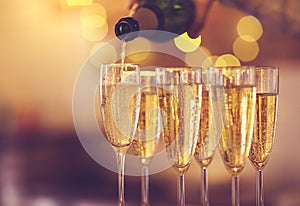 Champagne glasses on gold background. Party concept