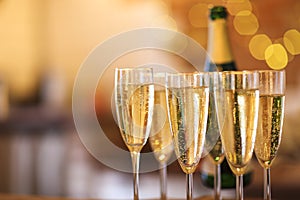 Champagne glasses on gold background. Party concept