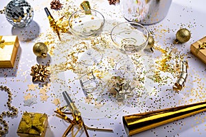 Champagne glasses with gold and silver colored decoration on table, copy space