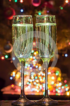 Champagne glasses on New Year's Eve. Merry christmas and a happy new year